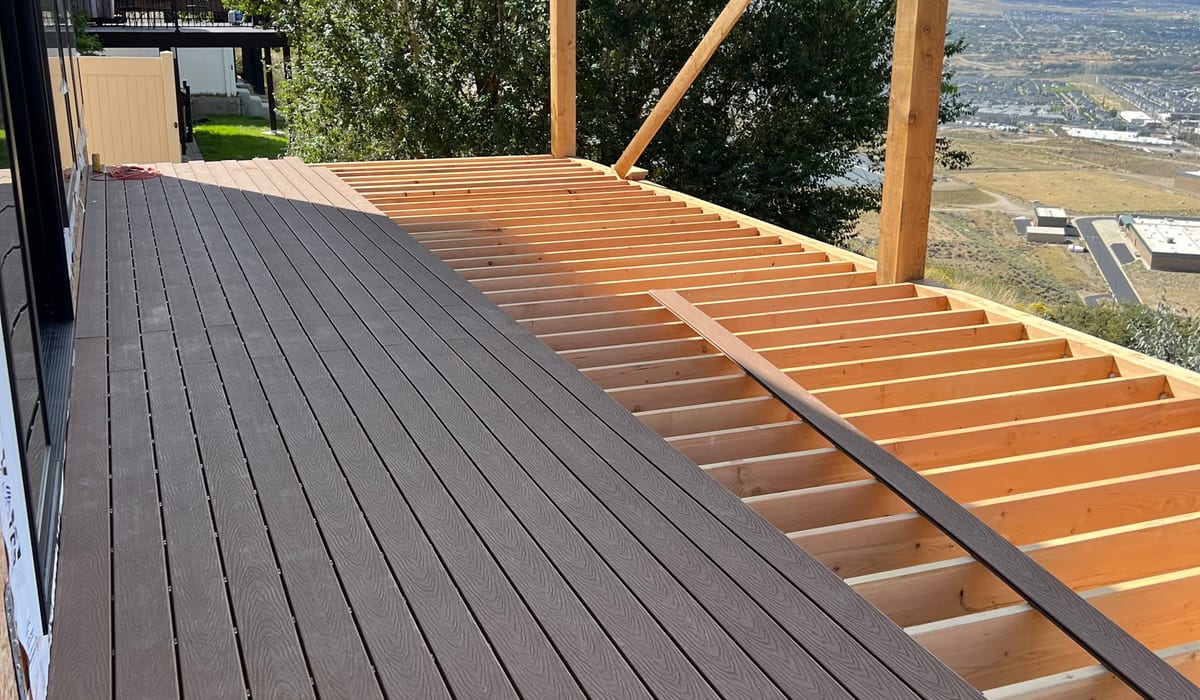 Composite deck and pergola with custom handrail in Alpine, Utah